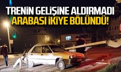 Trenin gelişine aldırmadı... Arabası ikiye bölündü!