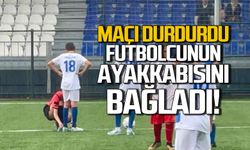 Kadın hakem maçı durdurup küçük futbolcunun ayakkabılarını bağladı