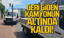 Geri giden kamyonun altında kaldı!