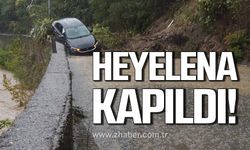 Heyelena kapılan otomobil sürüklendi!