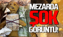 Mezarda şok görüntü: Bal mumu bebeğe sarılı muska bulundu!