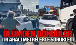 Ölümden döndüler: Tır otomobili metrelerce sürükledi!