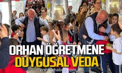 Orhan Yılmaz, öğrenci, öğretmen ve velilerin alkışlarıyla uğurlandı.