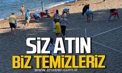 Kapuz Plajı'nda örnek mesai. Ekipler izmarit ve çöpleri tek tek topladı.