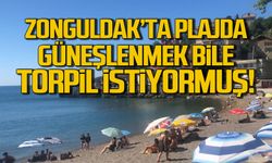 Denize girmek yasak güneşlenmek için torpil şart!