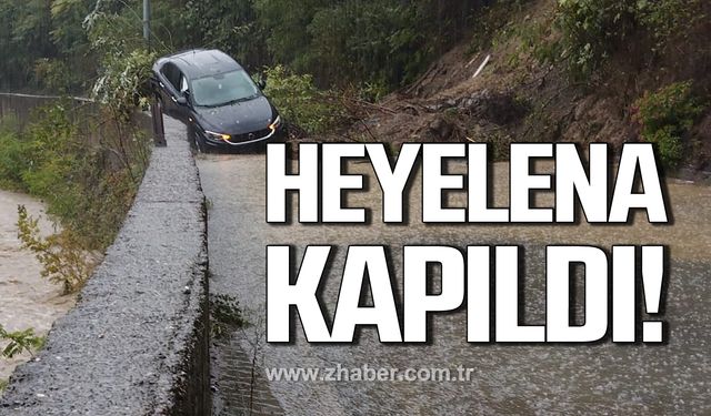 Heyelena kapılan otomobil sürüklendi!