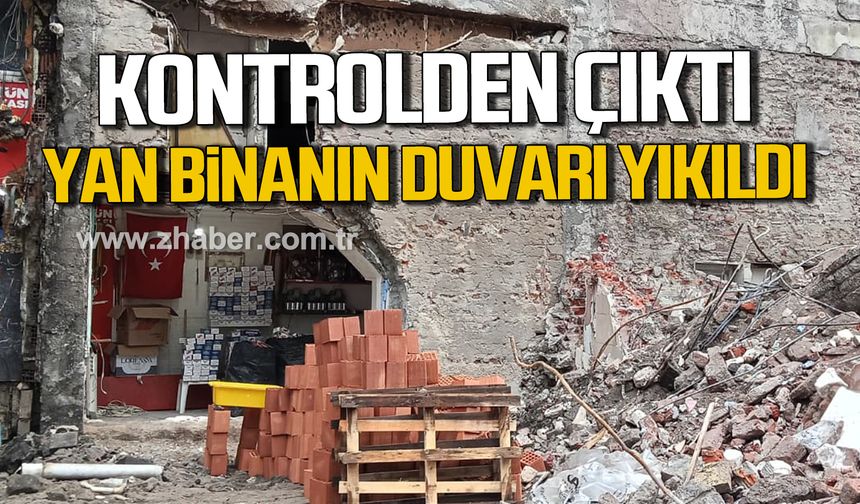 Zonguldak’ta yıkım kontrolden çıktı. Yan binanın duvarı zarar gördü.