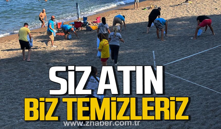 Kapuz Plajı'nda örnek mesai. Ekipler izmarit ve çöpleri tek tek topladı.