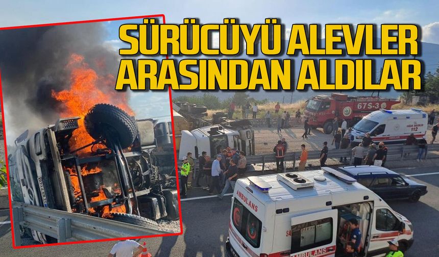 Devrilen tır alev alev yandı: Sürücüyü alevler arasından yaralı kurtardılar