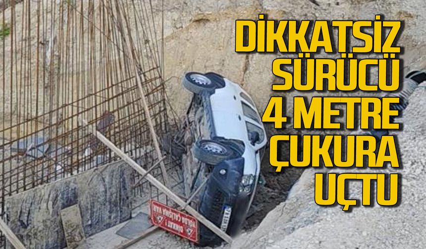 Dikkatsiz sürücü 4 metrelik çukura uçtu